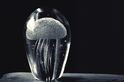 Close-up of glass against black background