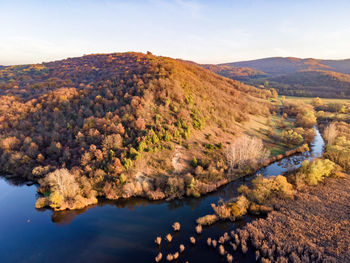 Scenic view of sea and mountains against sky