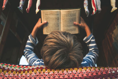 Boy reading book in motor home