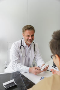 Doctor examining patient in hospital