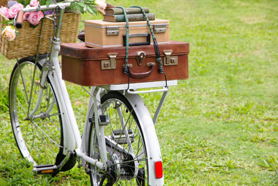 Close-up of bicycle parked on grassy field