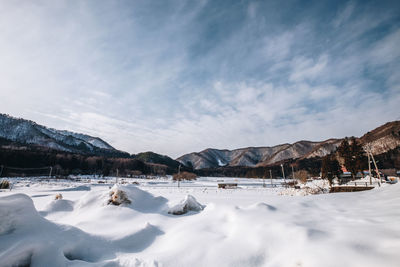 Scenic view of snowcapped mountains against sky