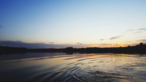 Scenic view of lake during sunset