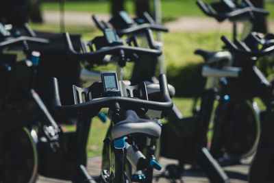 Close-up of exercise bikes in gym