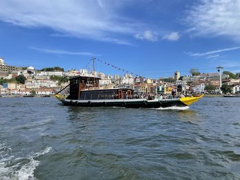Boats in sea against sky