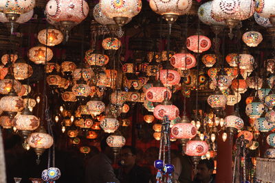 Illuminated lanterns hanging in store for sale in market