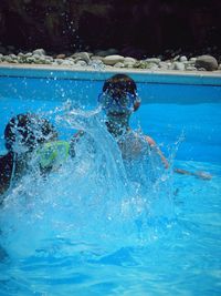 Man swimming in pool