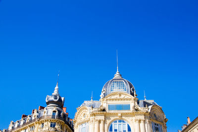 Low angle view of building against blue sky