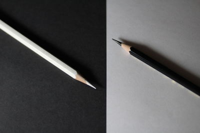 Directly above shot of pencils over two tone backgrounds