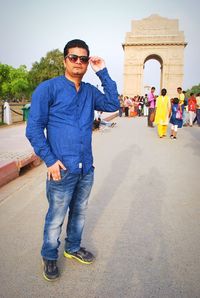 Full length of man wearing sunglasses standing outdoors