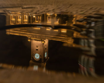 Close-up of illuminated lighting equipment on table in building