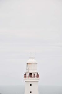 Lighthouse against sky during foggy weather