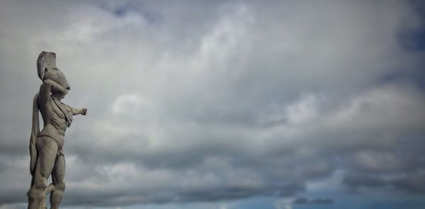 Low angle view of statue against sky