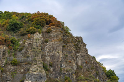 Low angle view of rock formation against sky