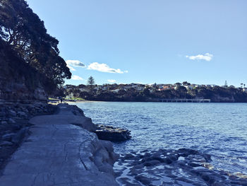 Scenic view of rocks against blue sky