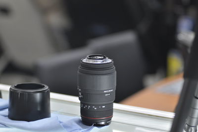 Close-up of camera lens on table