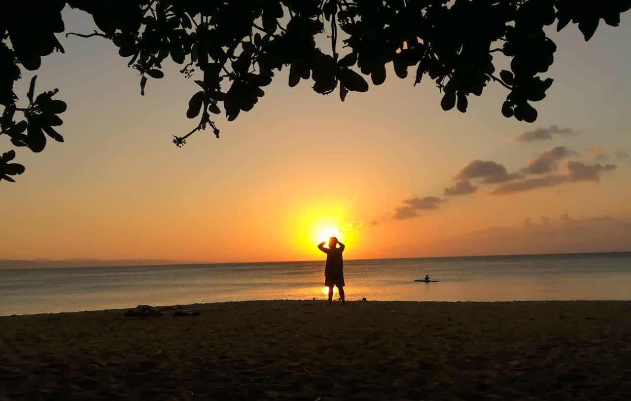 sunset, water, sky, sea, beach, land, scenics - nature, silhouette, beauty in nature, horizon, horizon over water, nature, real people, orange color, standing, leisure activity, men, lifestyles, tranquil scene, sun, outdoors