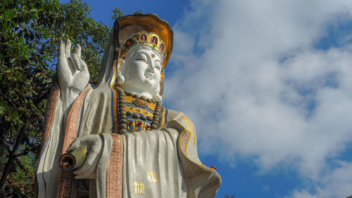 Low angle view of statue against sky