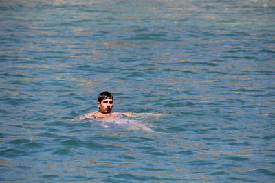 Portrait of man swimming in sea