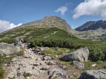 Scenic view of rocks and mountains against sky