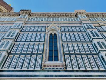 Low angle view of building against blue sky