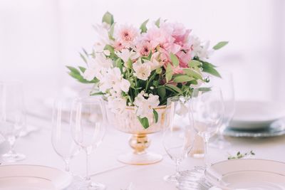 Flower vase on table at restaurant