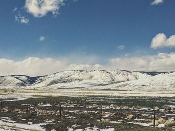 Scenic view of snowcapped mountains against sky