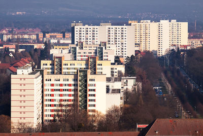 High angle view of buildings in city against sky