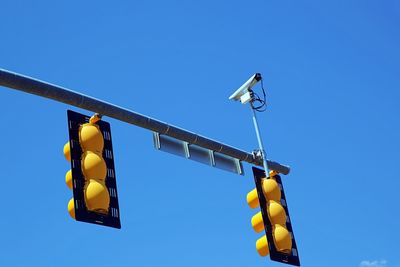 Traffic lights against blue sky