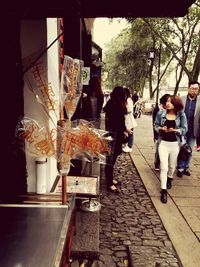 Full length of woman standing in city