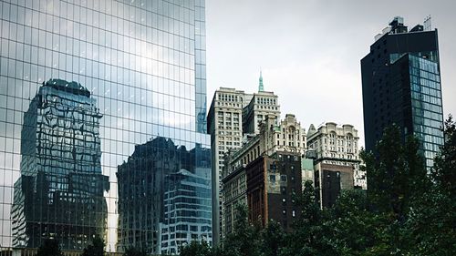 Low angle view of skyscrapers against sky