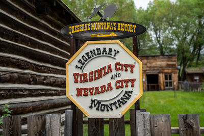 Close-up of sign against trees