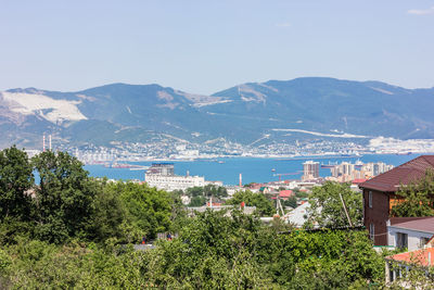 High angle view of townscape and mountains against sky