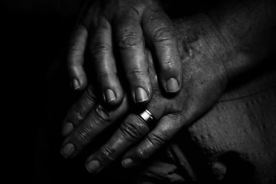 Close-up of hands in dark