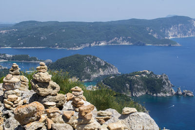 Scenic view of sea and rocks against sky