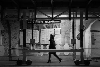 Full length of woman walking in tunnel