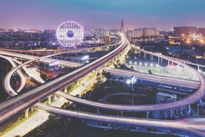 High angle view of light trails on highway at night