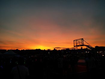 Silhouette of people at sunset