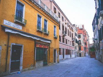 Footpath amidst buildings in town