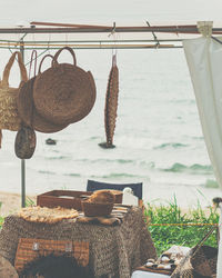 Clothes hanging on table at beach