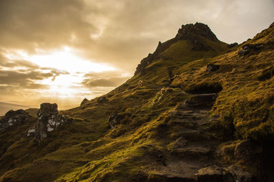 Low angle view of rock formations against sky during sunset