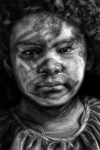 Close-up portrait of boy with face paint