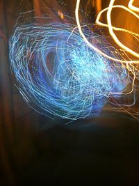 Close-up of light trails on bridge