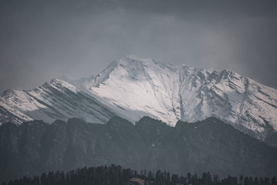 Snow covered mountains in the fog