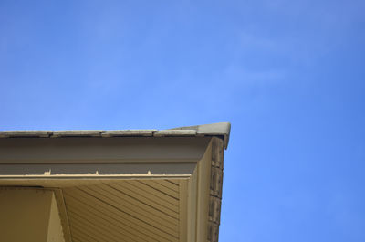 Low angle view of building against clear blue sky