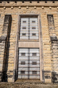 Abandoned prison brick wall and windows