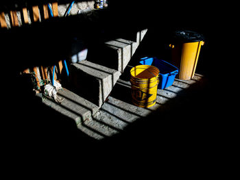 High angle view of empty chairs in the dark