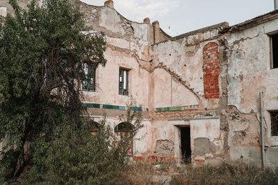 Abandoned building against sky