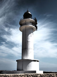 Low angle view of lighthouse against cloudy sky