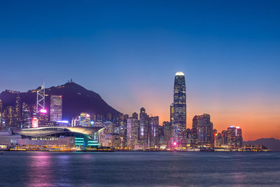 Illuminated buildings in city at night